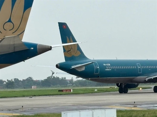 Two Vietnam Airlines aircrafts collide on a taxiway at the Noi Bai International Airport in Hanoi on June 27. (Photo courtesy of Noi Bai International Airport)